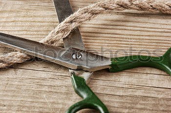 Pliers and twine on a plank