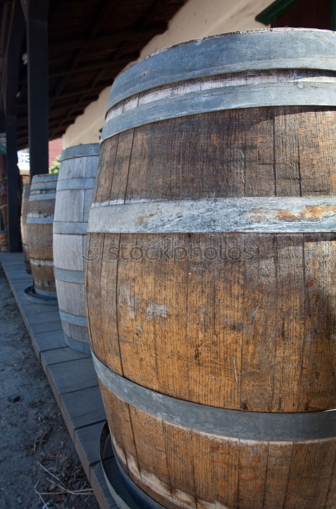 Similar – Image, Stock Photo Wooden barrels on stone surface