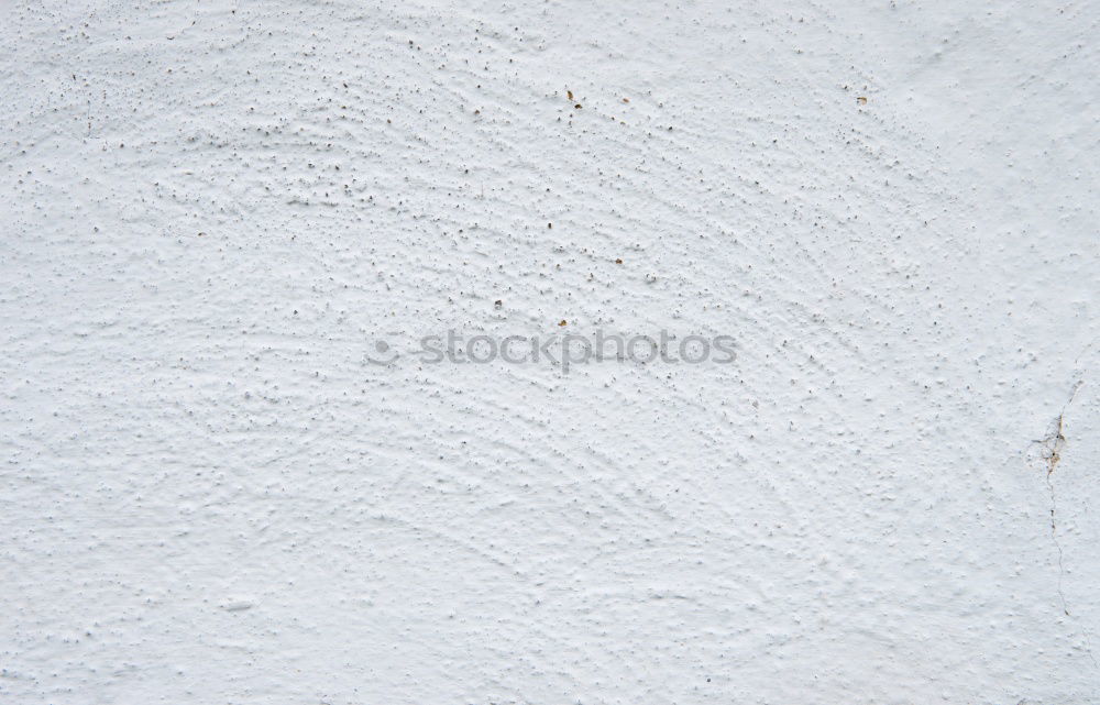 Similar – A piece of white adhesive tape over a crack in the plaster of a house wall