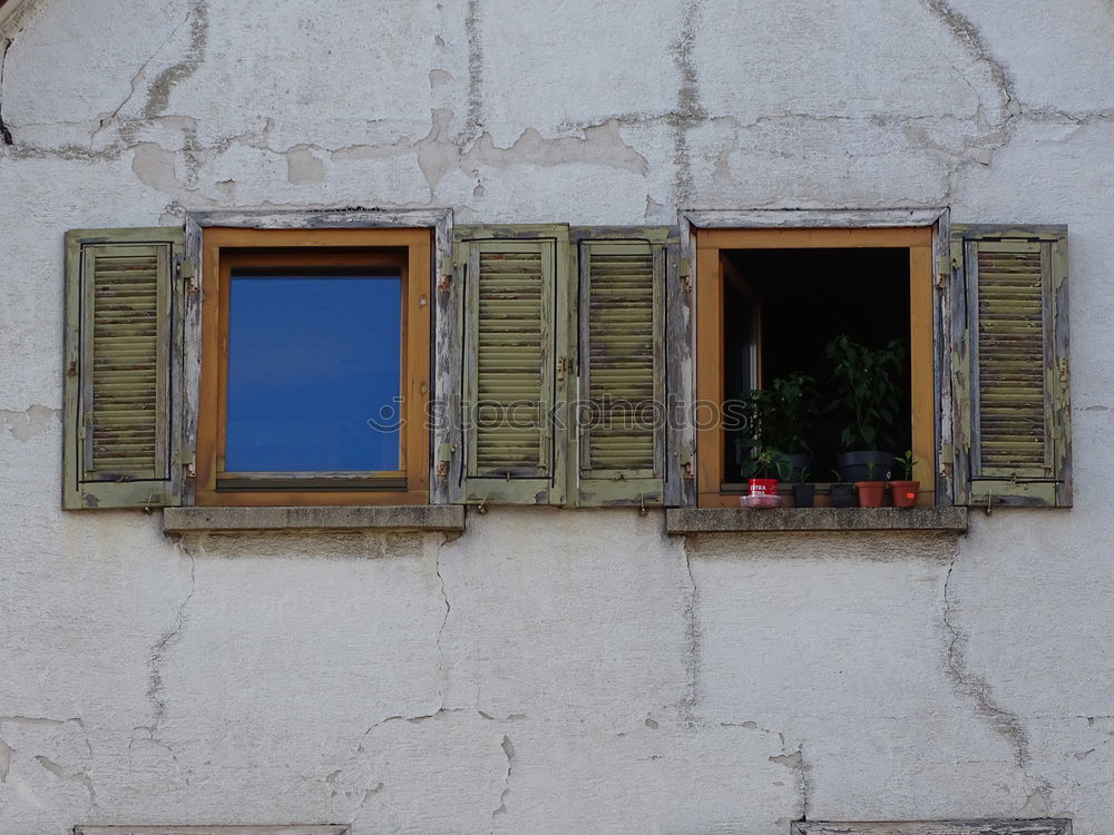 Similar – Window with shutters in red and white