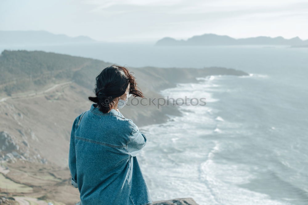 Similar – Man taking shot of island