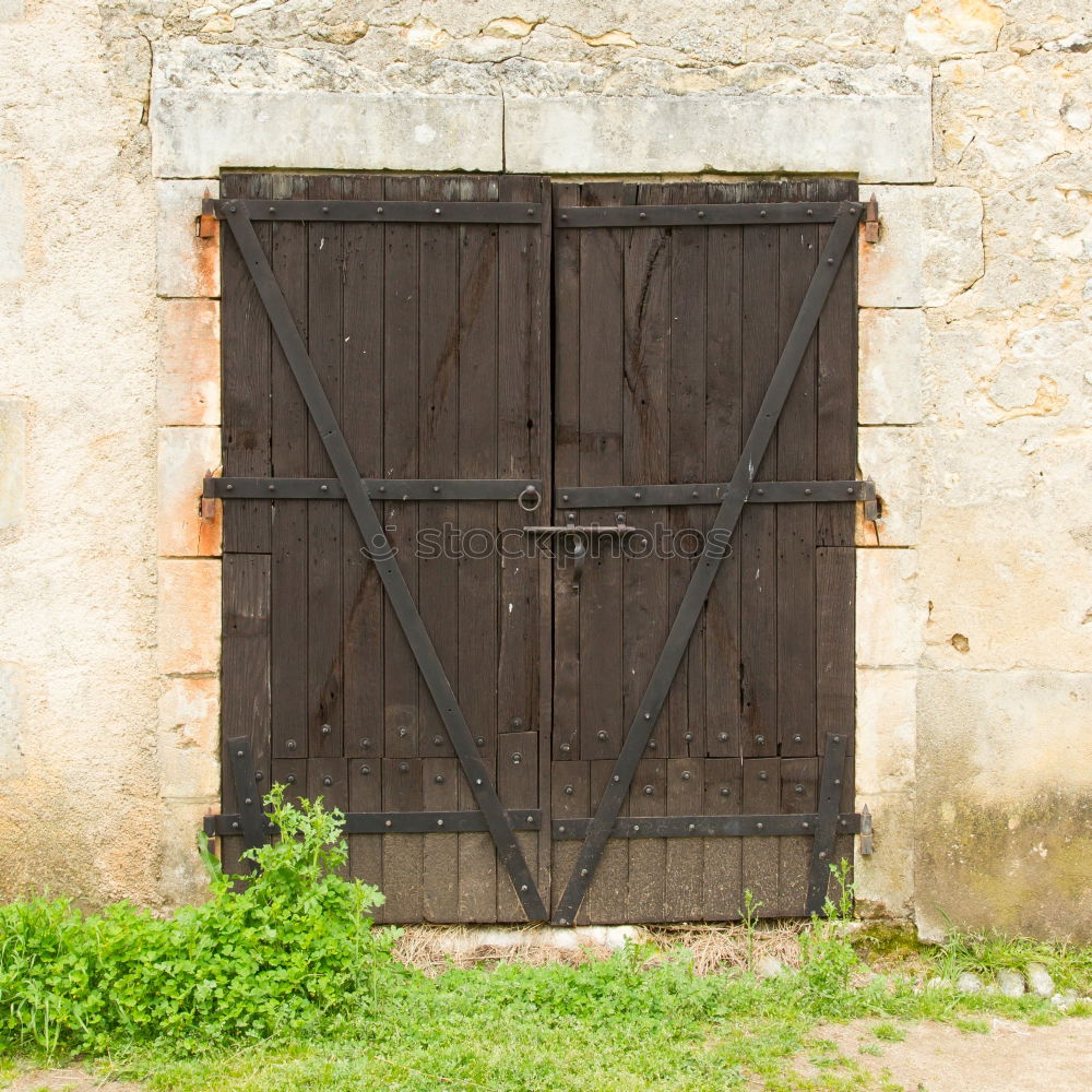 Similar – Locked door with hood