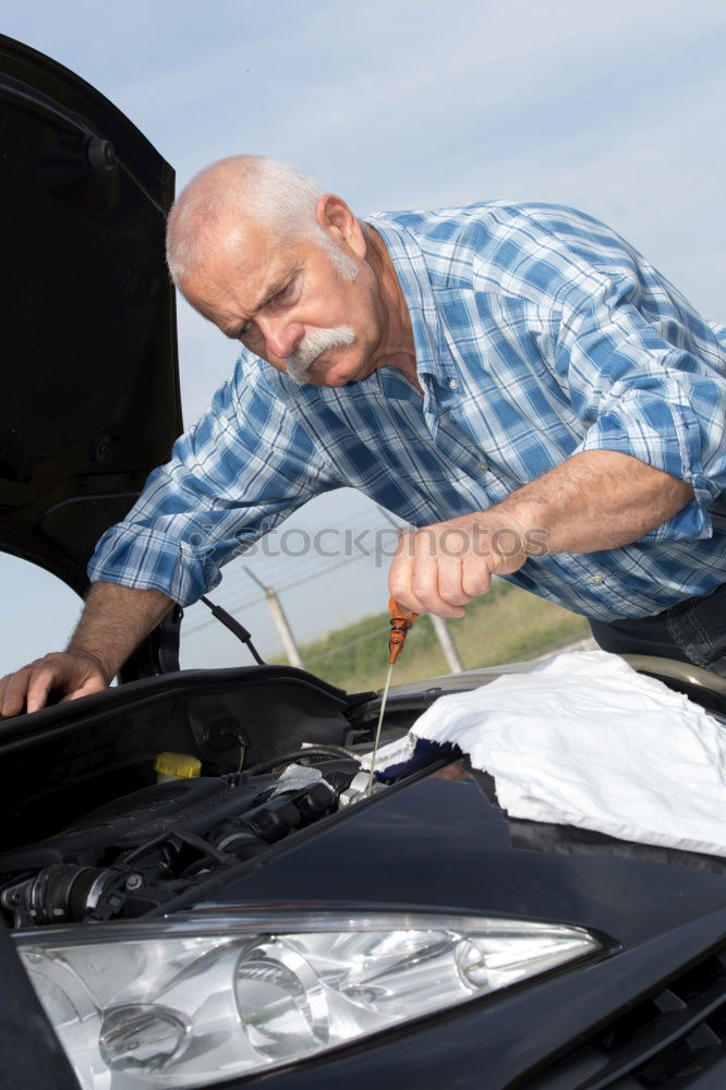 Similar – young guy repairing an old car