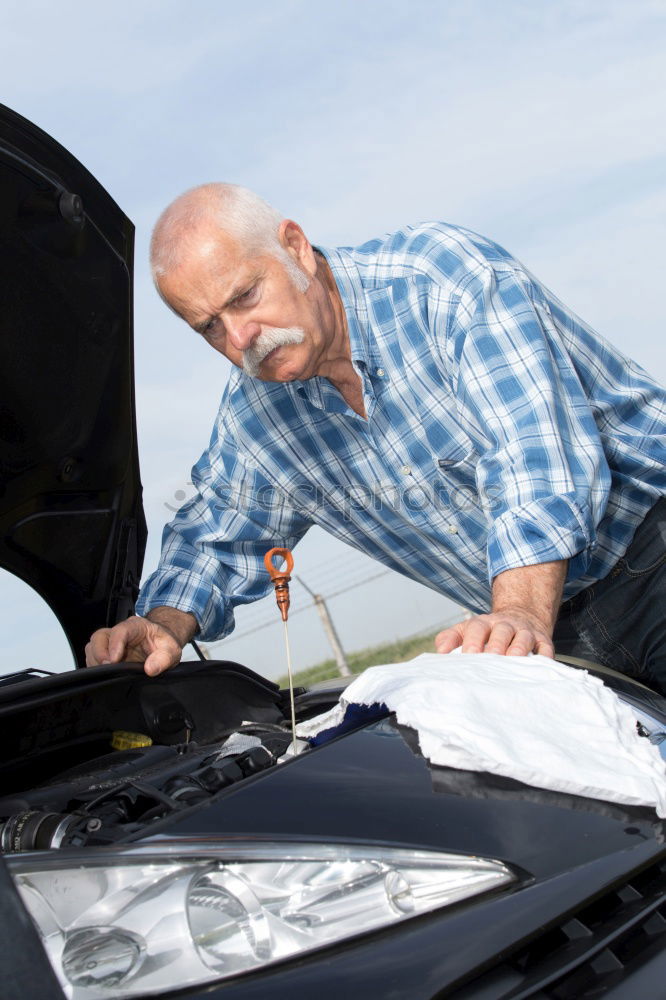 Similar – Image, Stock Photo man looks at the motor broken machine