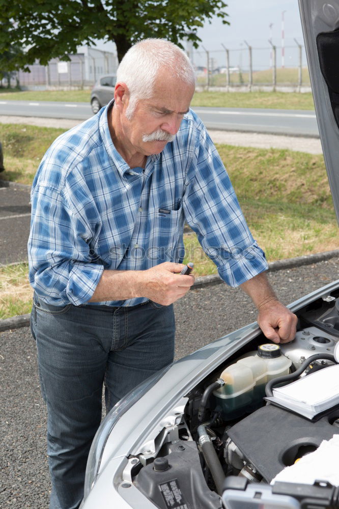 Similar – young guy repairing an old car