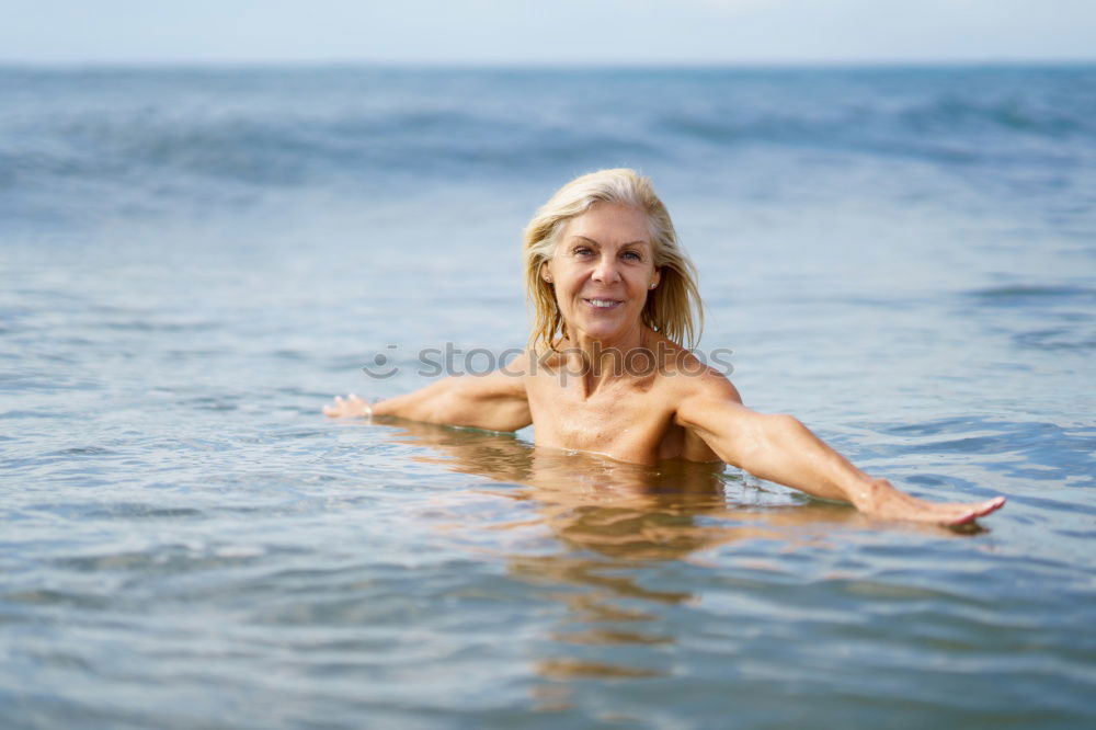 Similar – Foto Bild Reife Frau in guter Form beim Baden im Meer.