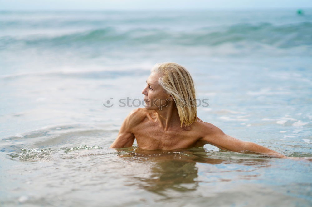 Similar – Foto Bild Reife Frau in guter Form beim Baden im Meer.