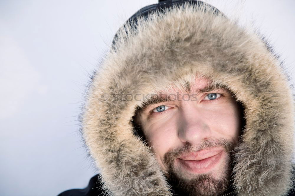 Similar – Happy man with a mustache in a knitted winter cap and warm winter clothing