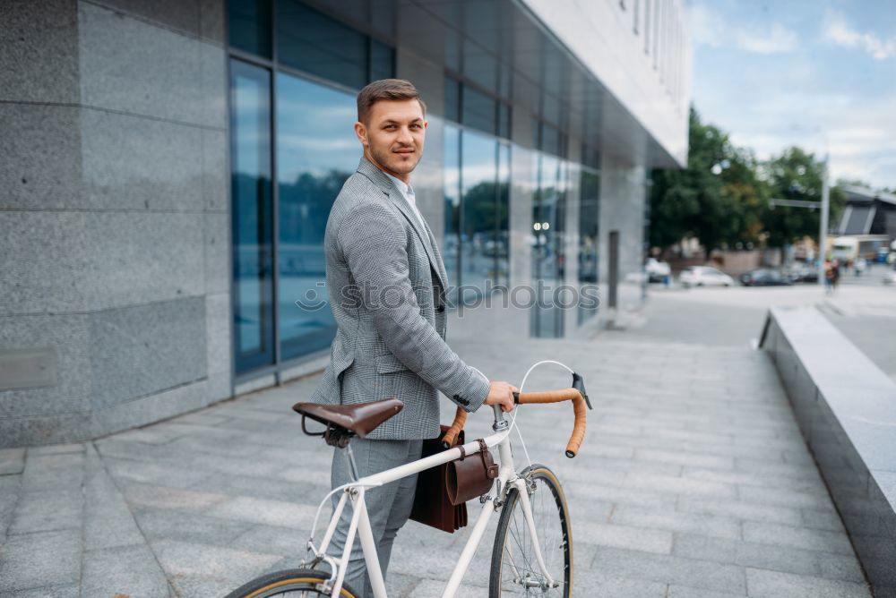 Image, Stock Photo Young man with mobile phone and fixed gear bicycle.