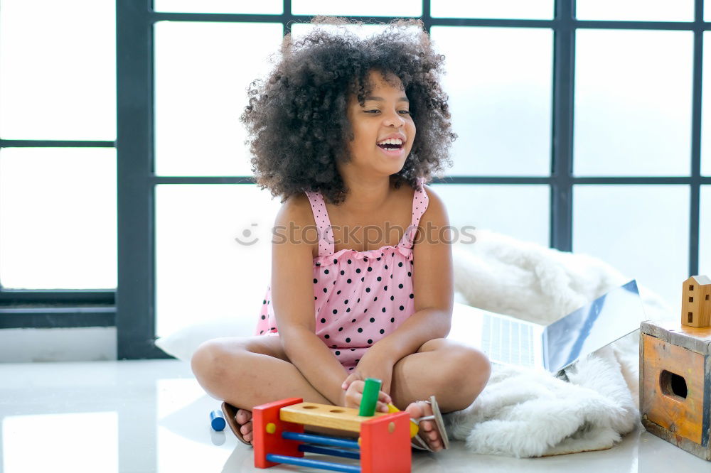 Similar – Image, Stock Photo African girl sits next to her teddy bear at home