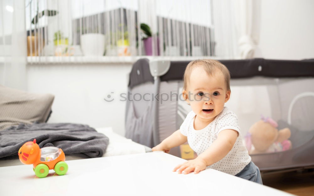 Similar – Image, Stock Photo Little boy sitting on the bed and smile