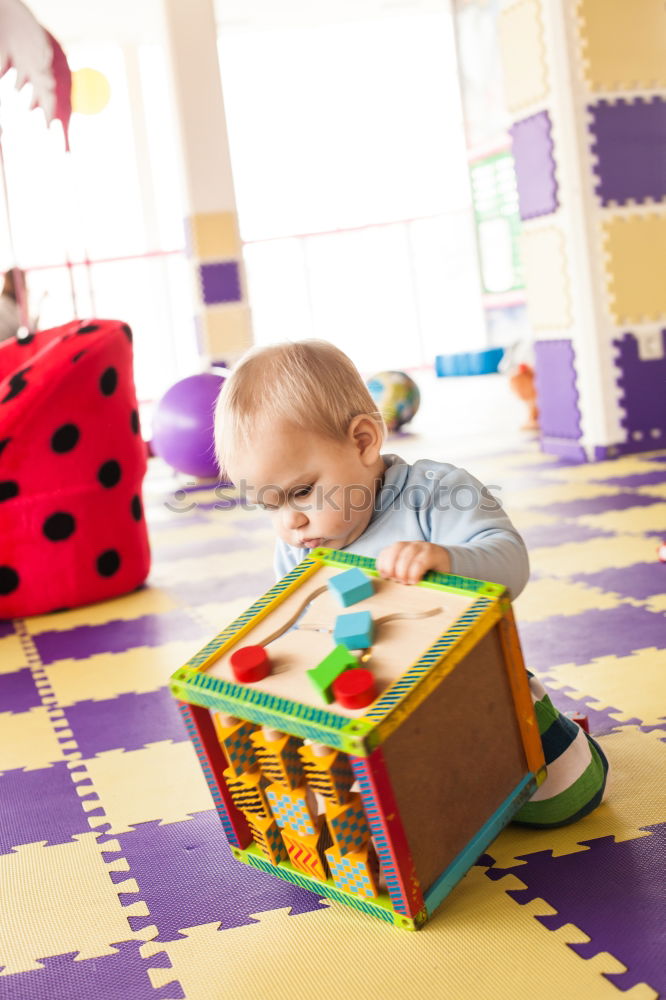 Similar – Happy baby playing with toy blocks.