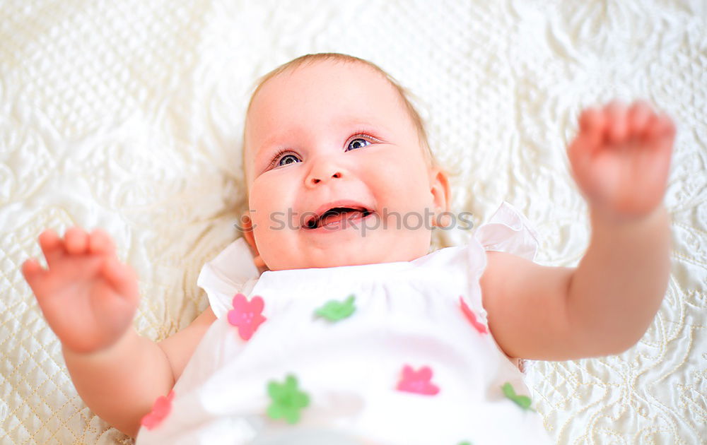 Similar – Little baby girl lying on blanket with colourful polka dots