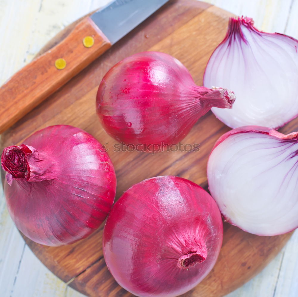 Similar – Red onion vegetable on the gray wooden surface