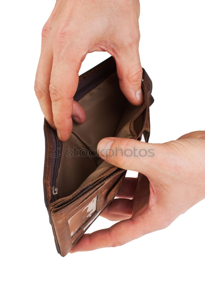 two female hands hold brown leather open empty wallet for cash