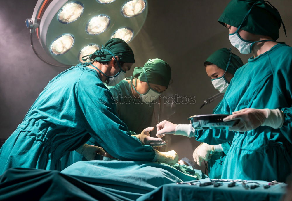 Similar – Image, Stock Photo Team of Surgeons Operating.