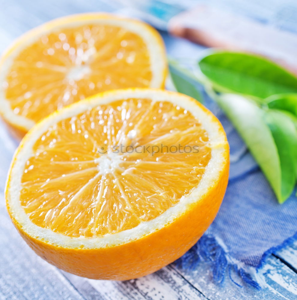 Image, Stock Photo Cut orange with green leaves