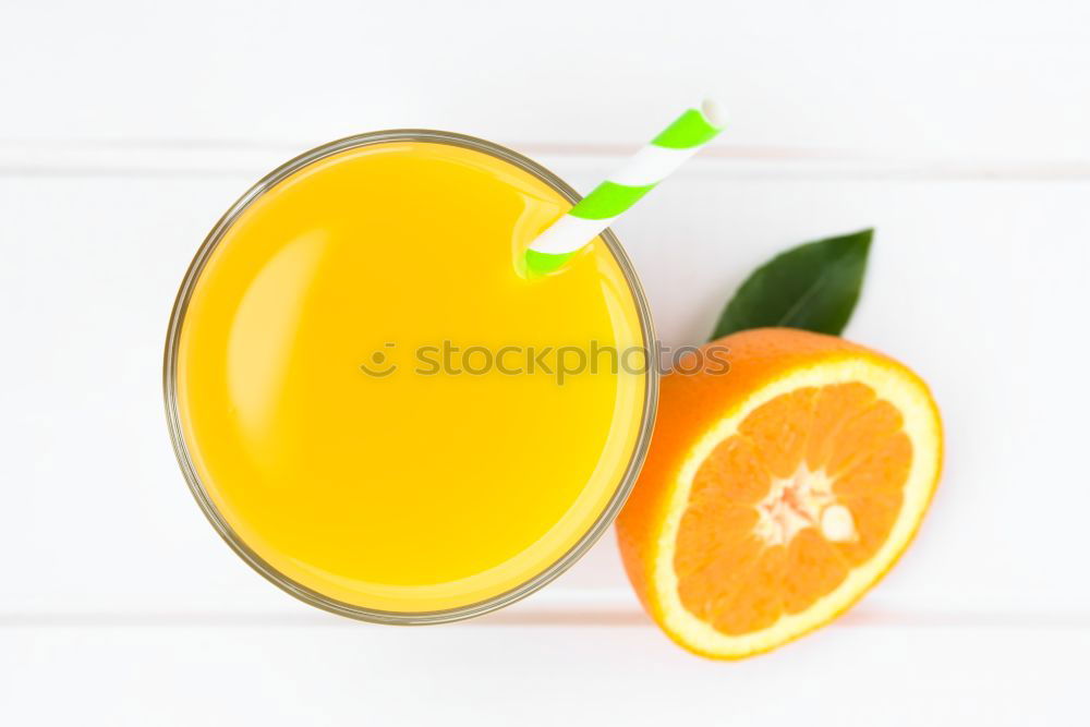 Similar – Glass of orange juice with slices of citrus fruit