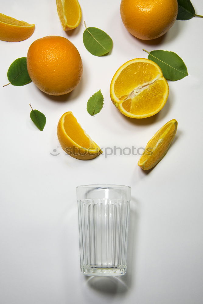 Similar – Image, Stock Photo A glass of soft drink with tangerine, cucumber and straw on white background