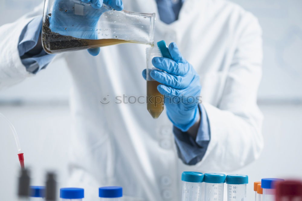Similar – Image, Stock Photo Worker putting liquid to test tube