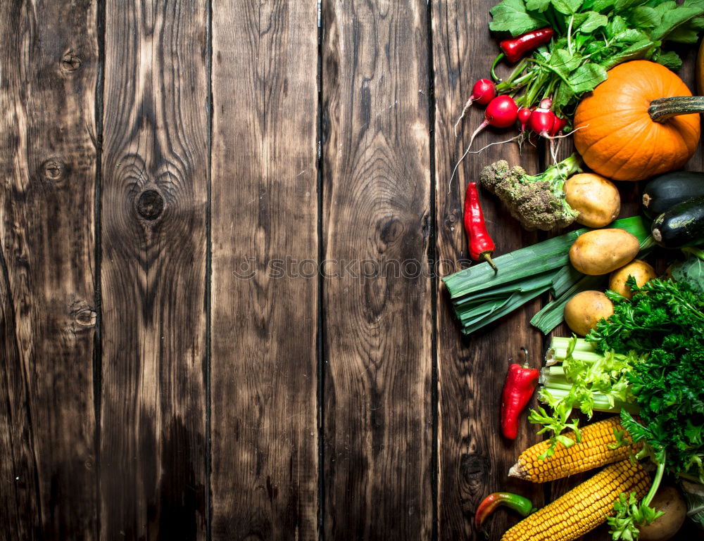 Similar – Various vegetables and oil on wooden tabletop