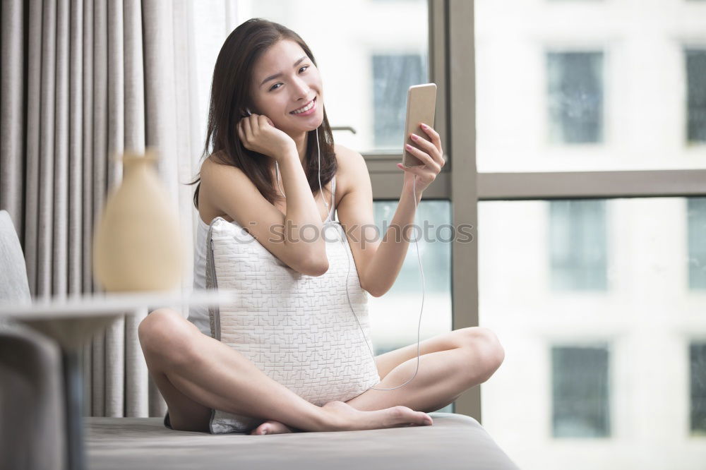 woman on bed enjoying a cup of coffee. morning