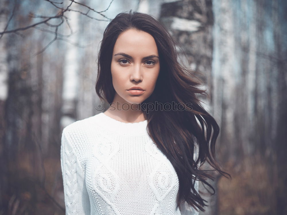 Similar – Brunette woman leaning on handrail at river