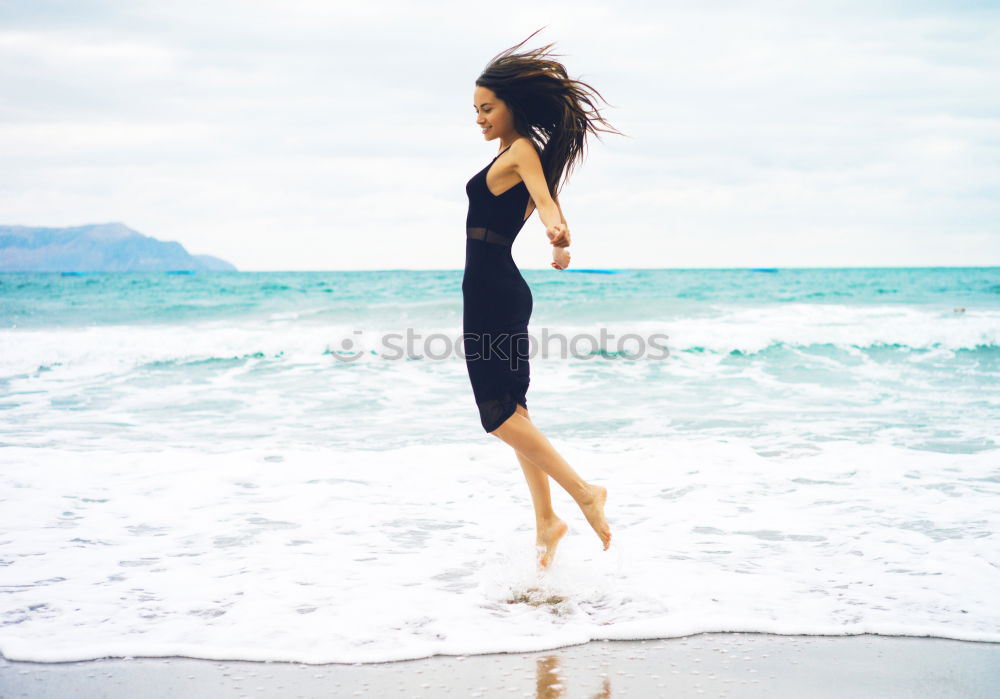 Similar – Image, Stock Photo Mixed Race female athlete resting after workout at the beach