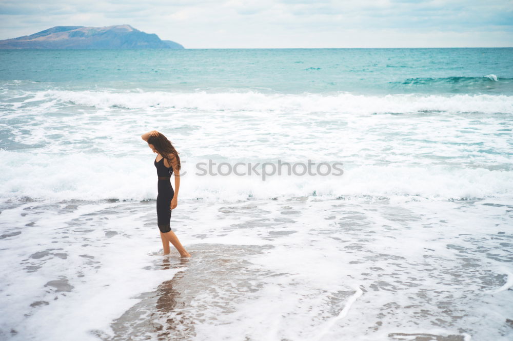 Similar – Image, Stock Photo Group of younf adult friends walking on the beach