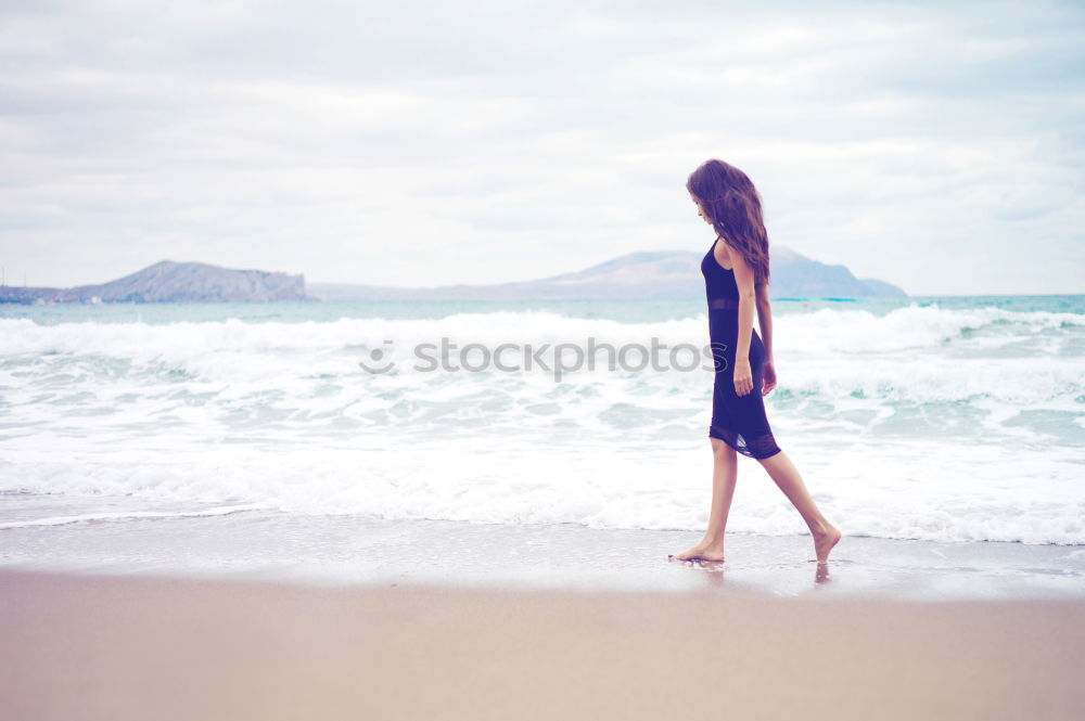 Similar – Image, Stock Photo caucasian mother and sun are walking into the water at the beach