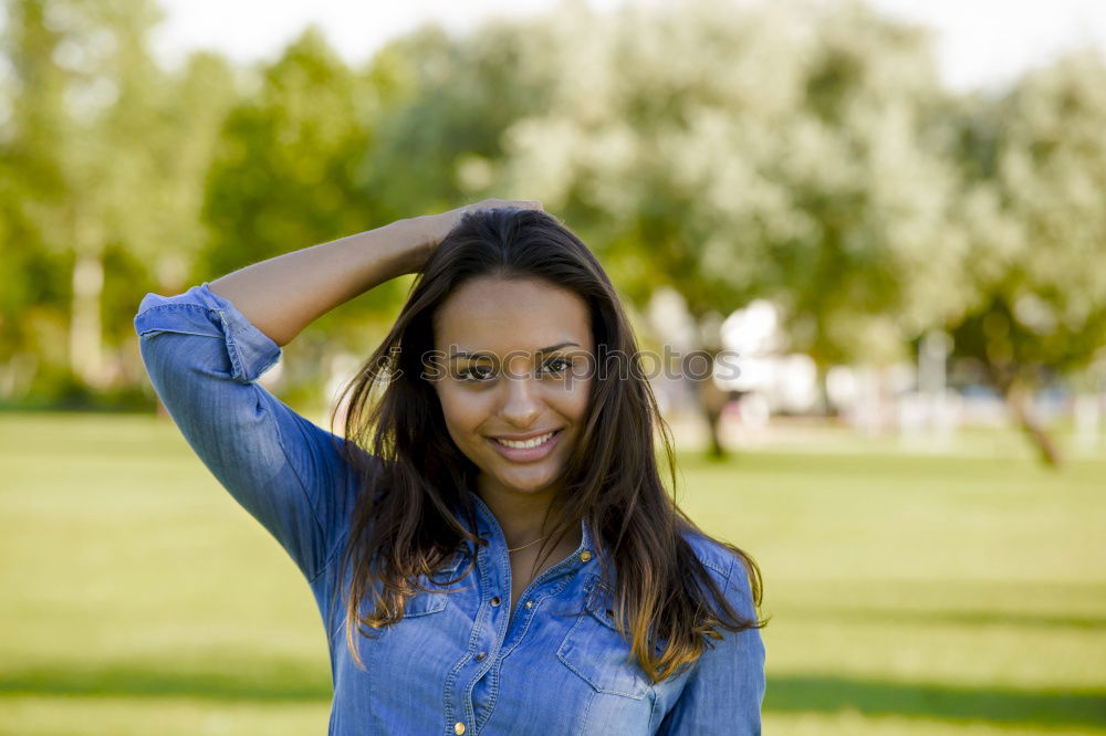 Similar – Image, Stock Photo Mixed female with afro hairstyle smiling in urban park.