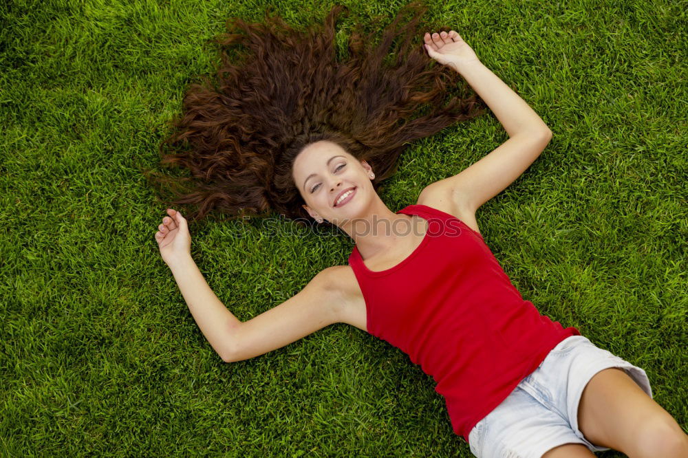 Similar – Image, Stock Photo young cheerful woman lying down on the grass