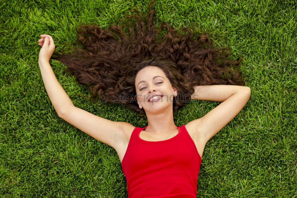 Image, Stock Photo young cheerful woman lying down on the grass