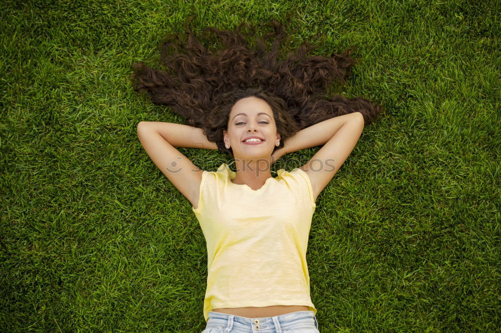 Similar – Image, Stock Photo young cheerful woman lying down on the grass