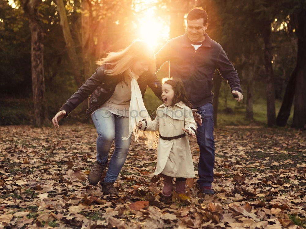 Similar – Image, Stock Photo Portrait of happy family enjoying together leisure over a wooden pathway into the forest