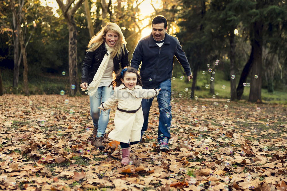 Similar – Image, Stock Photo Portrait of happy family enjoying together leisure over a wooden pathway into the forest