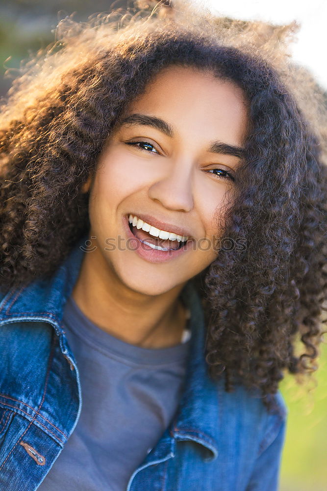 Similar – Portrait of young african woman stretching out tongue