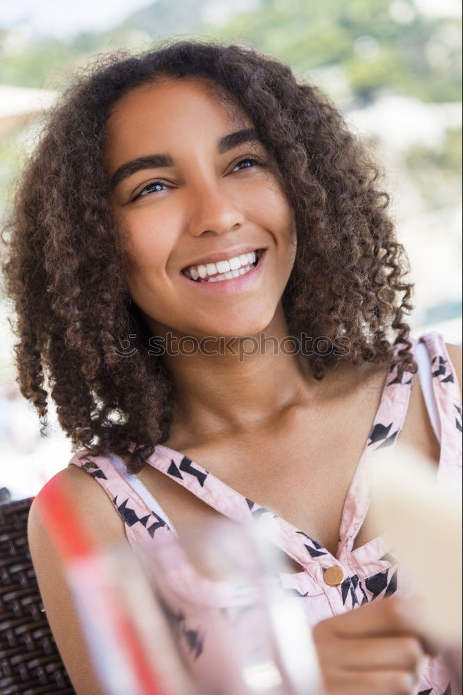 Similar – close up of a pretty black woman with curly hair smiling sit on bed looking at the camera