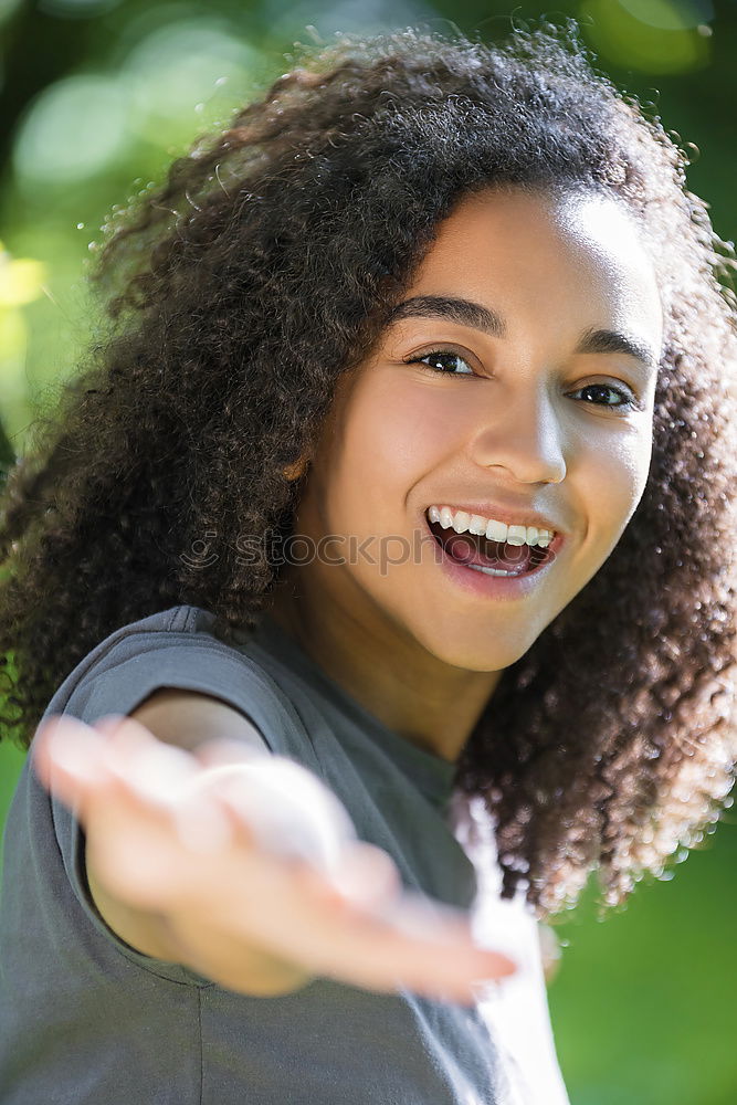 Similar – Young black woman, afro hairstyle, smiling.