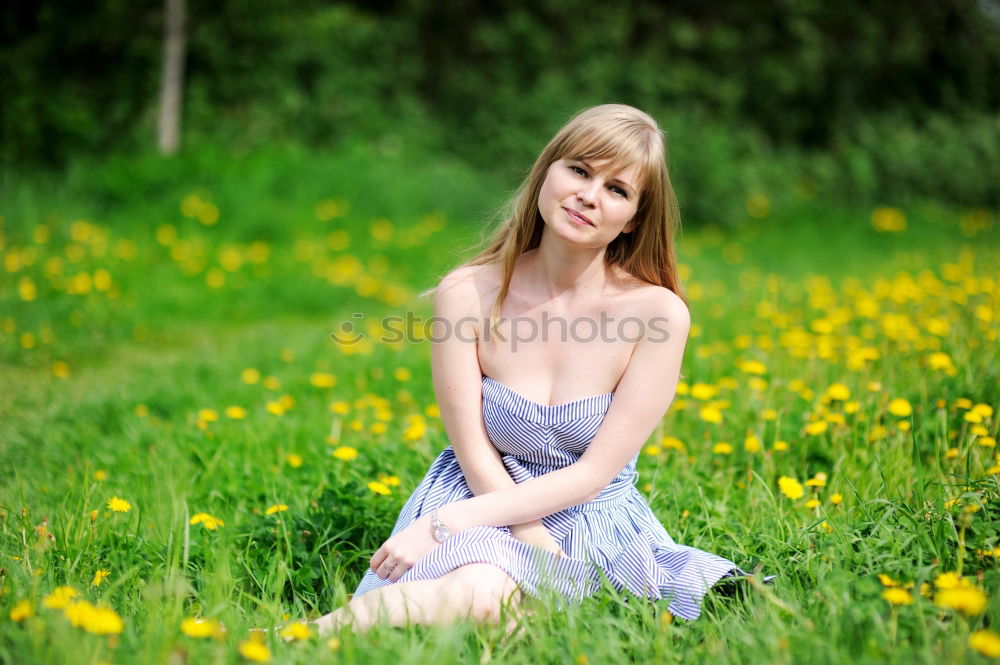 Similar – Woman with dreads sitting on a meadow