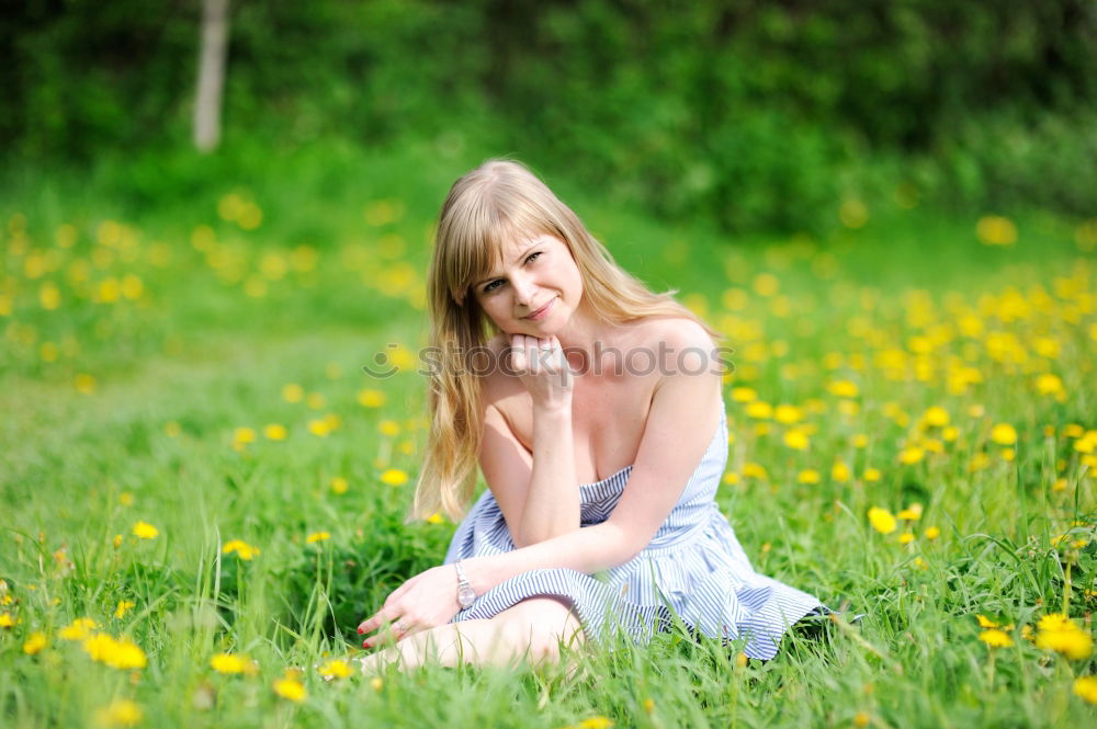 Similar – Woman with dreads sitting on a meadow