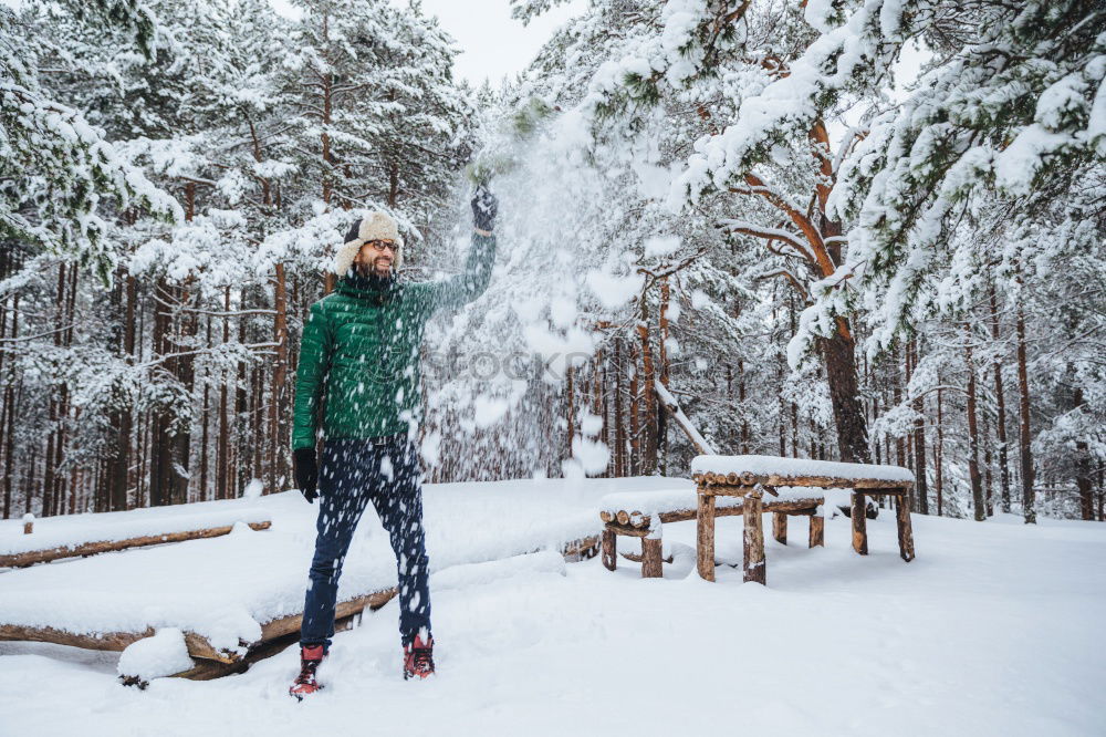 Similar – portrait Young pretty woman enjoying and playing with snow in winter