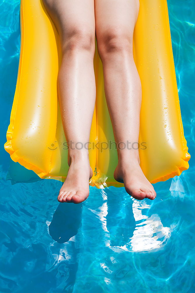 Similar – Image, Stock Photo Woman relaxing on inflatable ring in swimming pool