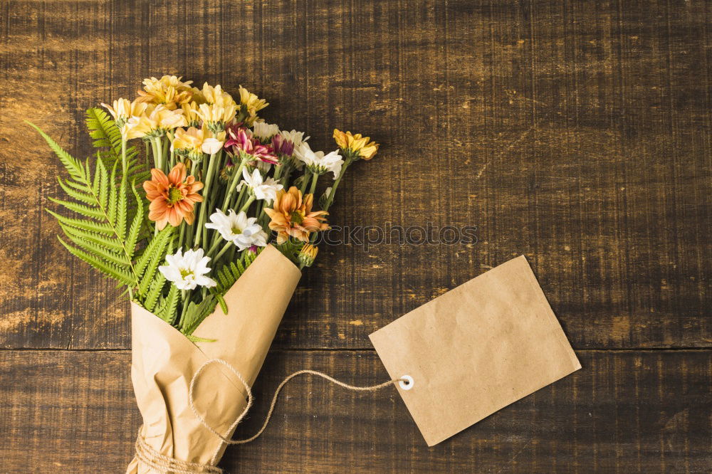 Bouquet of mixed flowers and a message card