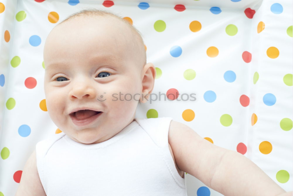 Similar – Little baby girl lying on blanket with colourful polka dots