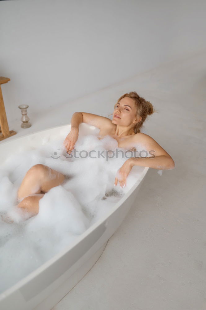 Similar – Woman lying in tub doing hydrotherapy treatment