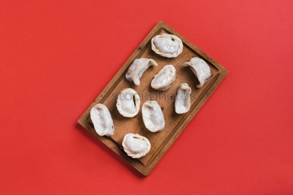 Similar – Image, Stock Photo Three different rolls on a red background