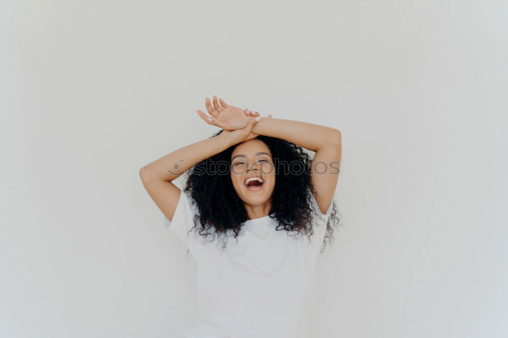 Similar – Young woman leaning on white wall