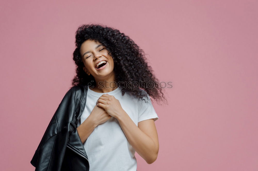 Similar – close up of a pretty black woman with curly hair smiling and covering with sheets on bed looking away