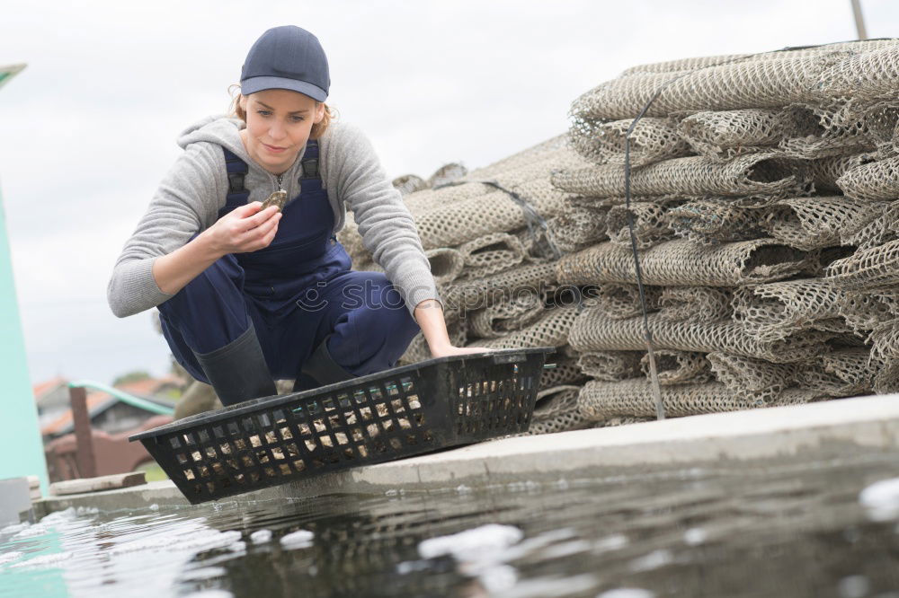 Similar – Image, Stock Photo Man working with fishing net